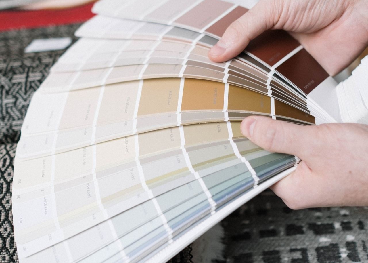 Color swatches against a backdrop of fabric samples, ideal for interior design projects Color swatches against a backdrop of fabric samples, ideal for interior design projects