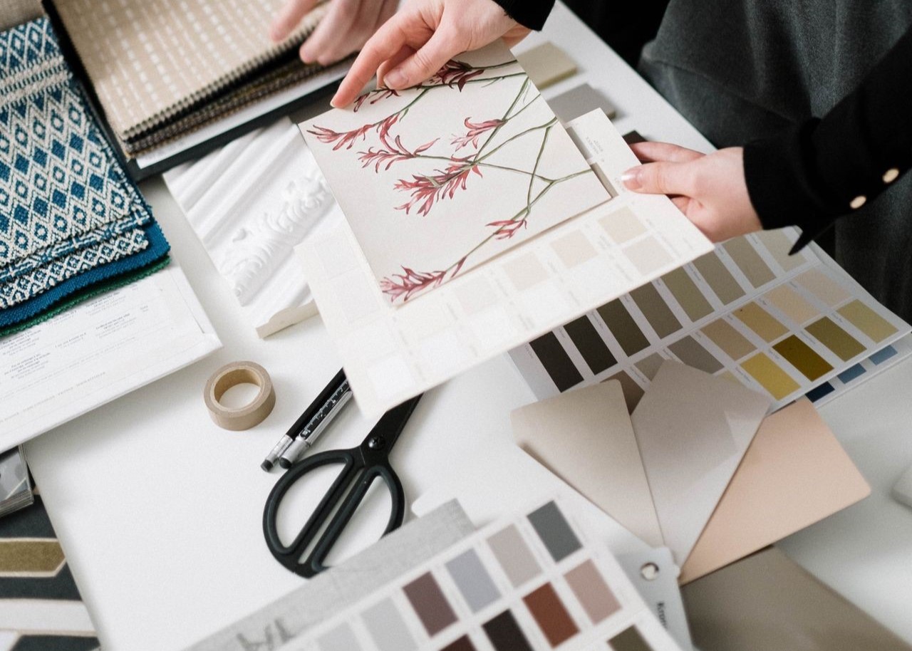 Interior designers collaborating with fabric samples and color swatches for a project. Interior designers collaborating with fabric samples and color swatches for a project