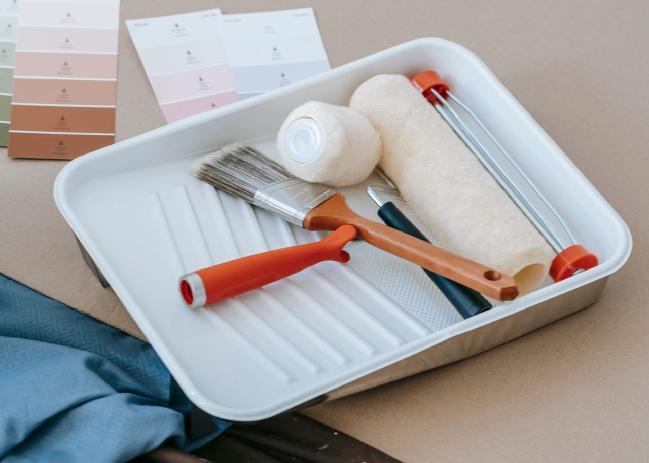 Paintbrush, roller, tray and swatches for renovation projects Paintbrush, roller, tray and swatches for renovation projects.